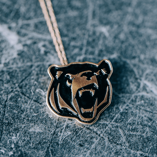 LR Bear Pendant As an Oz's Jewelers exclusive, this 10 kt yellow gold pendant is a true work of art, born from our partnership with Lenoir Rhyne University. It holds a special meaning, making it the perfect gift for your loved one or a cherished addition