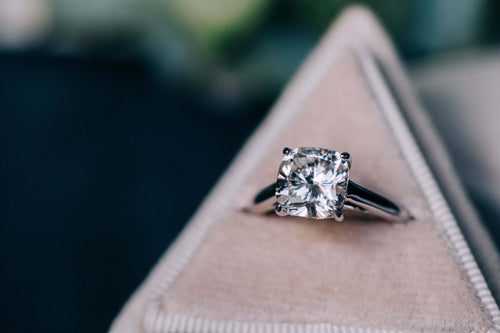 Lab Grown Cushion Cut Solitaire Engagement Ring Introducing our stunning Lab Grown Cushion Cut Solitaire Engagement Ring, the perfect symbol of your love and commitment. This exquisite piece features a hand-picked center stone, chosen by our team of speci